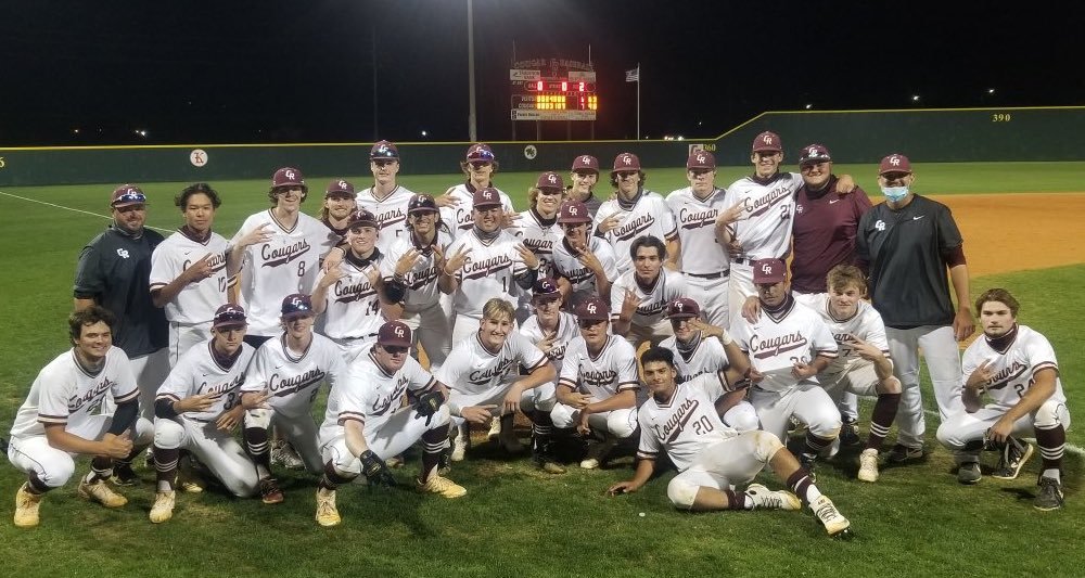 Cinco Ranch baseball players and coaches pose for a photo after their 7-6 Class 6A bi-district playoff win over Ridge Point on Friday, May 7, at Cinco Ranch High.
